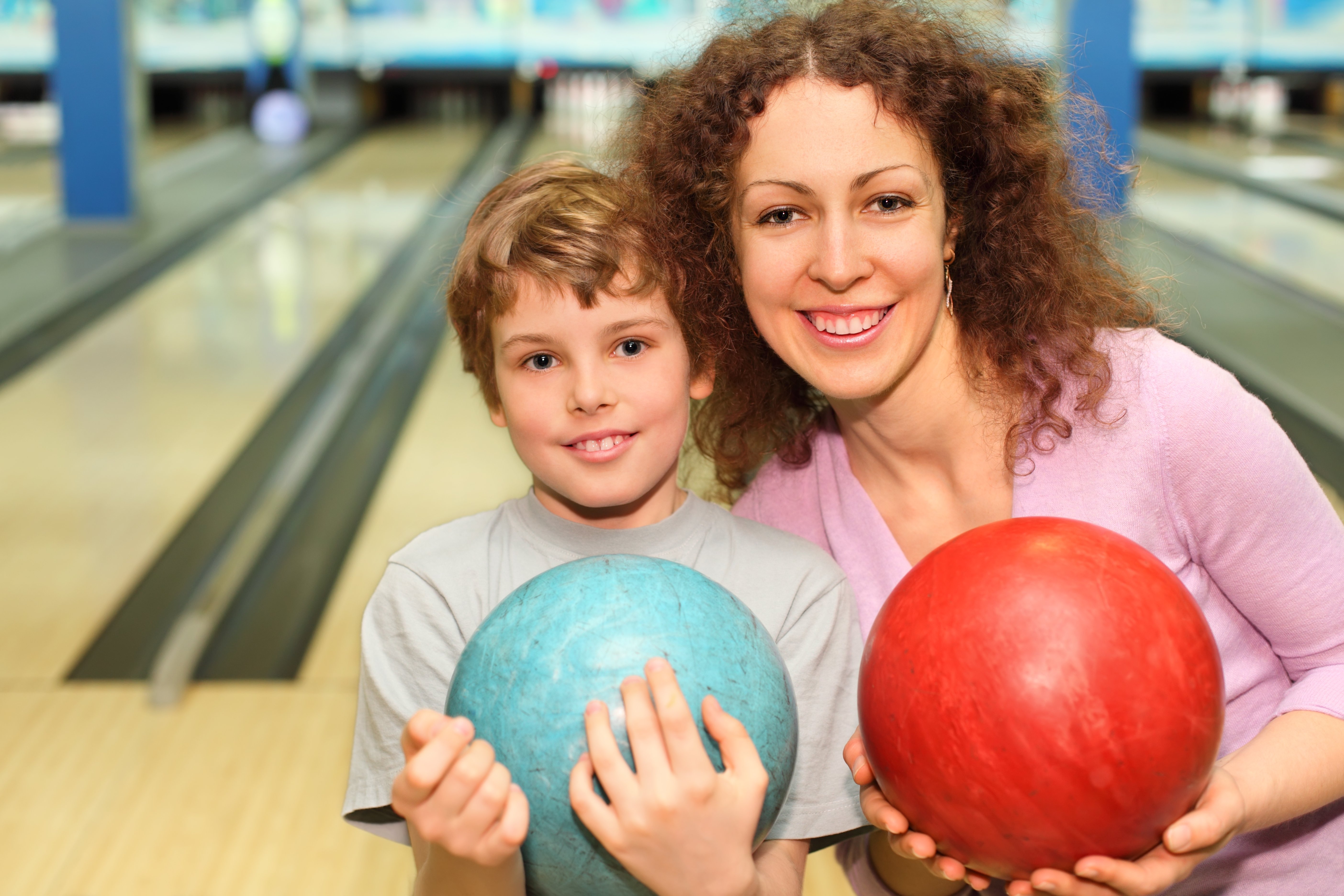 Mother and son bowling
